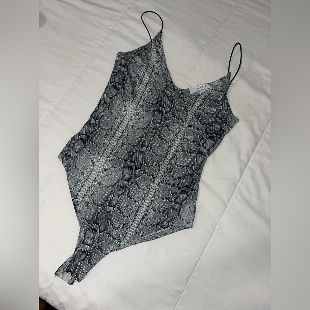 V-cross Bodysuit with straps, snake design, color is a grey ish- blue-ish color